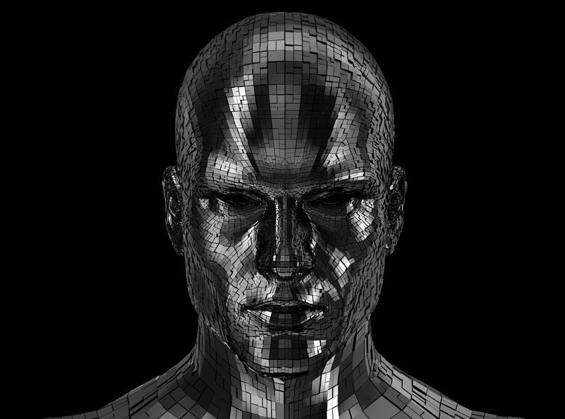 Robot head looking front on camera isolated on a black background